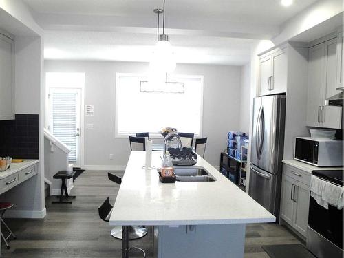 844 Lawthorn Way Se, Airdrie, AB - Indoor Photo Showing Kitchen With Stainless Steel Kitchen With Double Sink With Upgraded Kitchen