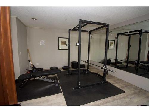 209-35 Richard Court Sw, Calgary, AB - Indoor Photo Showing Gym Room