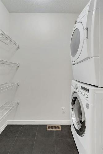 1406 Auburn Bay Square Se, Calgary, AB - Indoor Photo Showing Laundry Room