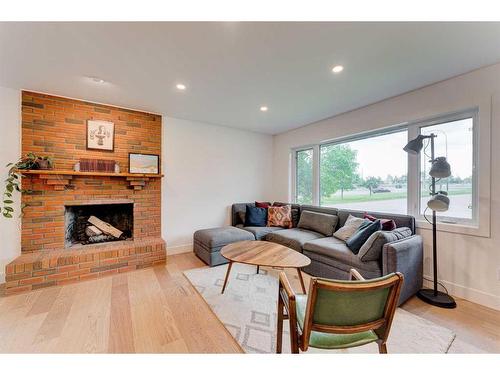 118 Fullerton Road Se, Calgary, AB - Indoor Photo Showing Living Room With Fireplace