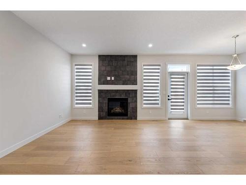 125 Creekstone Path Sw, Calgary, AB - Indoor Photo Showing Living Room With Fireplace