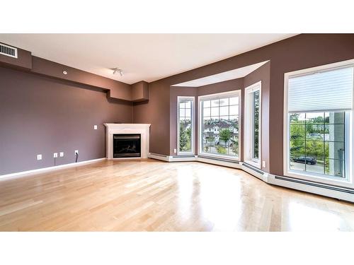 387-223 Tuscany Springs Boulevard Nw, Calgary, AB - Indoor With Fireplace