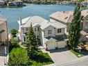 146 Coral Shores Cape Ne, Calgary, AB  - Outdoor With Body Of Water With Facade 