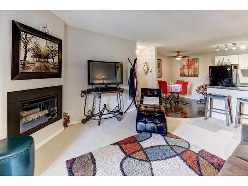 3021 Edenwold Heights Nw, Calgary, AB - Indoor Photo Showing Living Room With Fireplace