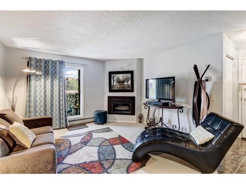 3021 Edenwold Heights Nw, Calgary, AB - Indoor Photo Showing Living Room With Fireplace