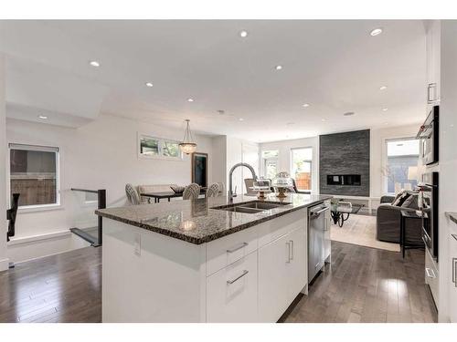 3147 35 Avenue Sw, Calgary, AB - Indoor Photo Showing Kitchen With Fireplace With Double Sink With Upgraded Kitchen