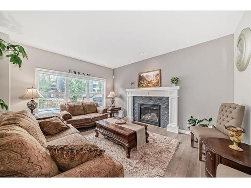 54 Masters Mews Se, Calgary, AB - Indoor Photo Showing Living Room With Fireplace