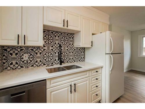 106 Abalone Crescent Ne, Calgary, AB - Indoor Photo Showing Kitchen With Double Sink