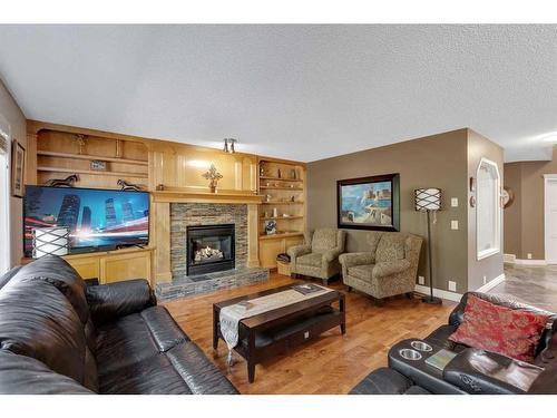 26 Scenic Ridge Way Nw, Calgary, AB - Indoor Photo Showing Living Room With Fireplace