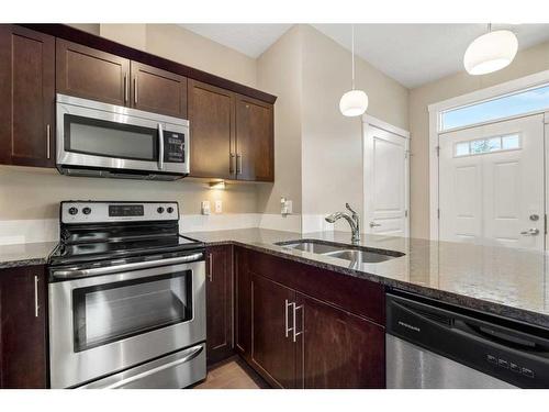 1802 Evanston Square Nw, Calgary, AB - Indoor Photo Showing Kitchen With Stainless Steel Kitchen With Double Sink