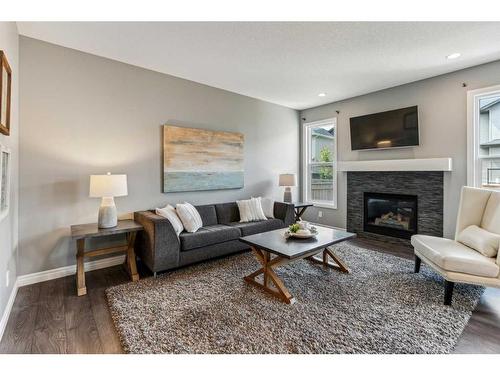 255 Nolan Hill Drive Nw, Calgary, AB - Indoor Photo Showing Living Room With Fireplace