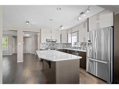 125 Hidden Spring Circle Nw, Calgary, AB - Indoor Photo Showing Kitchen With Stainless Steel Kitchen With Upgraded Kitchen
