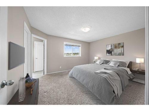 125 Hidden Spring Circle Nw, Calgary, AB - Indoor Photo Showing Bedroom