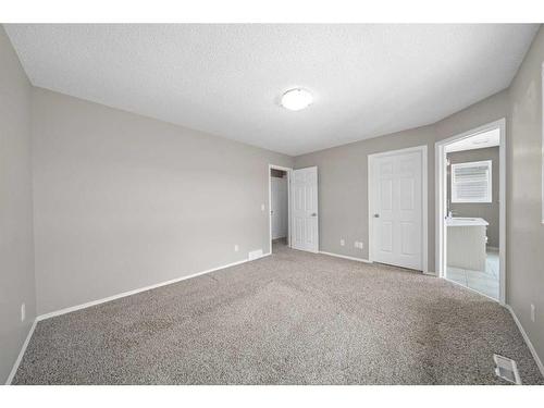 125 Hidden Spring Circle Nw, Calgary, AB - Indoor Photo Showing Other Room