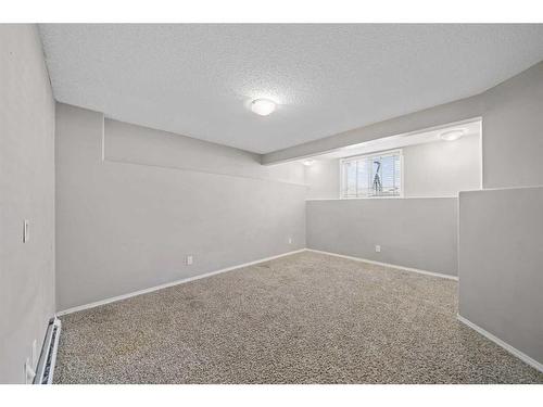 125 Hidden Spring Circle Nw, Calgary, AB - Indoor Photo Showing Other Room