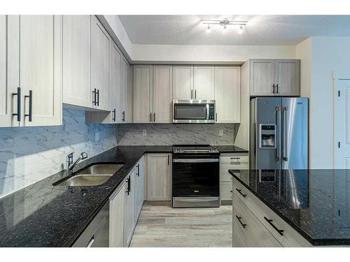 5205-15 Sage Meadows Landing Nw, Calgary, AB - Indoor Photo Showing Kitchen With Stainless Steel Kitchen With Double Sink With Upgraded Kitchen