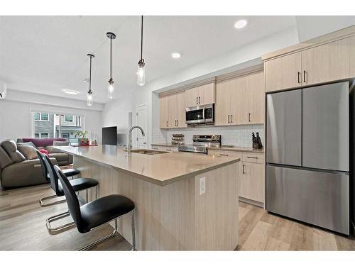 2208-220 Seton Grove Se, Calgary, AB - Indoor Photo Showing Kitchen With Stainless Steel Kitchen With Upgraded Kitchen