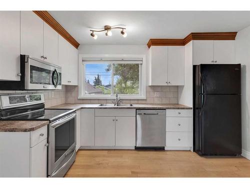 635 Arlington Drive Se, Calgary, AB - Indoor Photo Showing Kitchen With Stainless Steel Kitchen With Double Sink