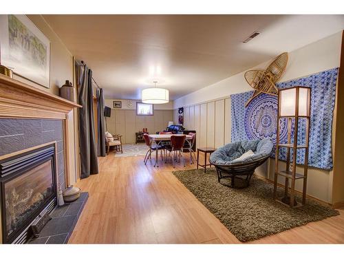 4908 8 Street West, Claresholm, AB - Indoor Photo Showing Other Room With Fireplace