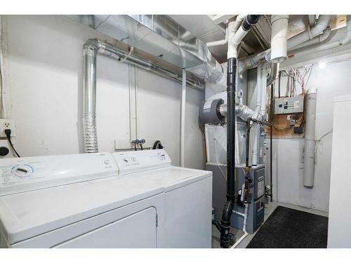 144 Oaktree Lane Sw, Calgary, AB - Indoor Photo Showing Laundry Room