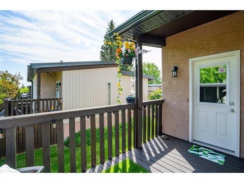 144 Oaktree Lane Sw, Calgary, AB - Outdoor With Deck Patio Veranda With Exterior