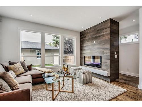 830 22 Avenue Nw, Calgary, AB - Indoor Photo Showing Living Room With Fireplace