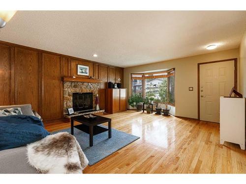 159 Deerbow Circle Se, Calgary, AB - Indoor Photo Showing Living Room With Fireplace