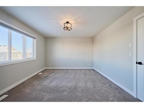 48 Shawnee Green Sw, Calgary, AB - Indoor Photo Showing Other Room