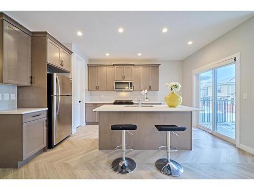 48 Shawnee Green Sw, Calgary, AB - Indoor Photo Showing Kitchen With Stainless Steel Kitchen With Upgraded Kitchen