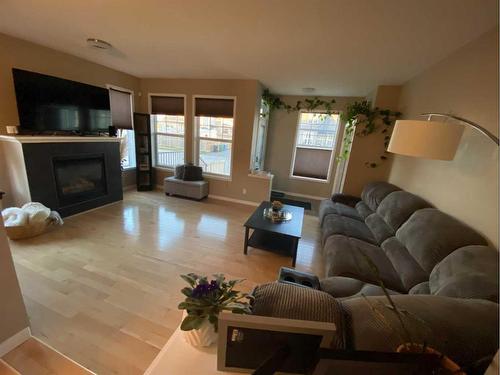 5 Autumn Terrace Se, Calgary, AB - Indoor Photo Showing Living Room With Fireplace