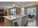 118 Cranberry Mews Se, Calgary, AB  - Indoor Photo Showing Kitchen With Double Sink 