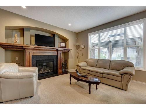 118 Cranberry Mews Se, Calgary, AB - Indoor Photo Showing Living Room With Fireplace