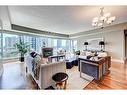 2208-920 5 Avenue Sw, Calgary, AB  - Indoor Photo Showing Living Room With Fireplace 