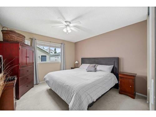 102 Hidden Crescent Nw, Calgary, AB - Indoor Photo Showing Bedroom