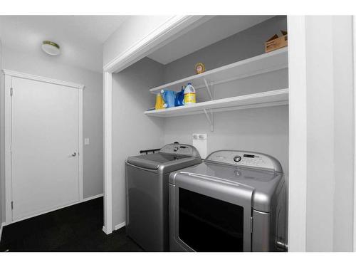 195 Sandstone Drive, Okotoks, AB - Indoor Photo Showing Laundry Room