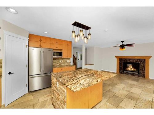 164 Bridlepost Green Sw, Calgary, AB - Indoor With Fireplace