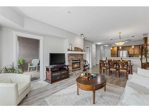 428-30 Discovery Ridge Close Sw, Calgary, AB - Indoor Photo Showing Living Room With Fireplace