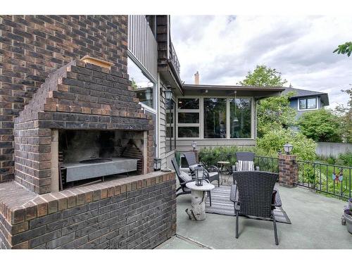 12 37 Street Sw, Calgary, AB - Outdoor With Fireplace