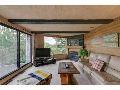 12 37 Street Sw, Calgary, AB - Indoor Photo Showing Living Room With Fireplace