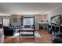 279 Coventry Circle Ne, Calgary, AB  - Indoor Photo Showing Living Room With Fireplace 