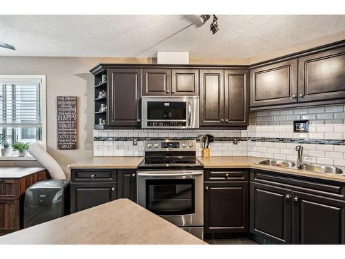 5101-5101 Valleyview Park Se, Calgary, AB - Indoor Photo Showing Kitchen With Double Sink