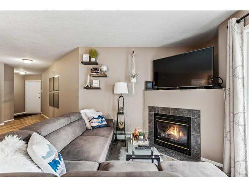5101-5101 Valleyview Park Se, Calgary, AB - Indoor Photo Showing Living Room With Fireplace