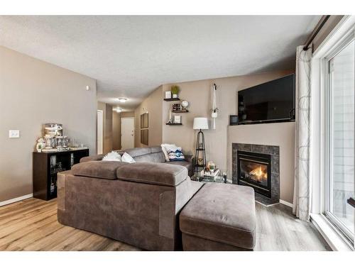 5101-5101 Valleyview Park Se, Calgary, AB - Indoor Photo Showing Living Room With Fireplace