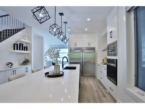 708 13 Street Ne, Calgary, AB - Indoor Photo Showing Kitchen With Stainless Steel Kitchen With Upgraded Kitchen