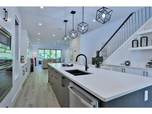 708 13 Street Ne, Calgary, AB - Indoor Photo Showing Kitchen With Double Sink With Upgraded Kitchen