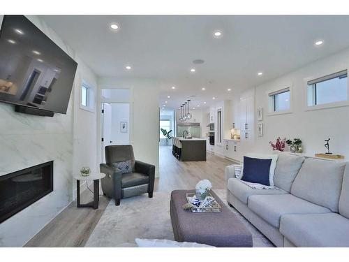 708 13 Street Ne, Calgary, AB - Indoor Photo Showing Living Room With Fireplace
