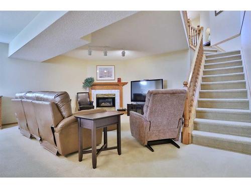 247 Hamptons Park Nw, Calgary, AB - Indoor With Fireplace