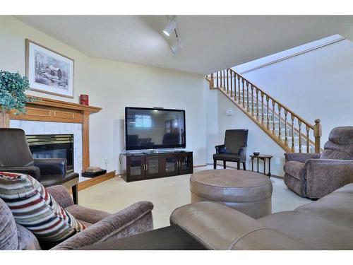 247 Hamptons Park Nw, Calgary, AB - Indoor Photo Showing Living Room With Fireplace