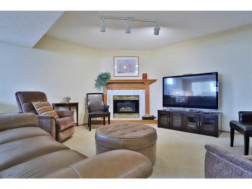 247 Hamptons Park Nw, Calgary, AB - Indoor Photo Showing Living Room With Fireplace