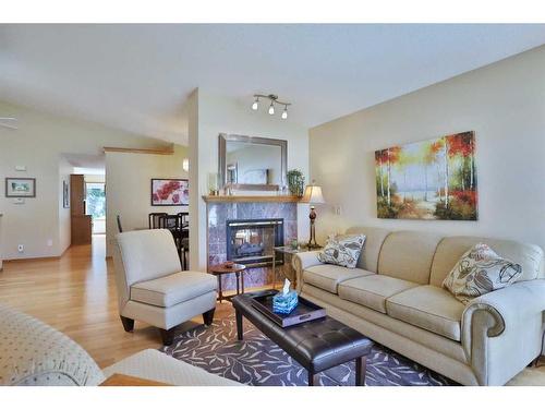 247 Hamptons Park Nw, Calgary, AB - Indoor Photo Showing Living Room With Fireplace
